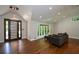 Inviting living room featuring a modern front door, a bay window, and stylish hardwood flooring for a welcoming atmosphere at 2116 Strasburg Ct, Atlanta, GA 30338