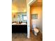 Bathroom featuring dual sinks, granite counters, a door to the toilet room, and tile floors at 3227 Puritan Way, Mcdonough, GA 30252