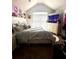 Bright bedroom with a queen-sized bed, vaulted ceilings, and a dresser, all bathed in natural light at 3227 Puritan Way, Mcdonough, GA 30252