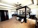 Bedroom showcasing a large bed, ceiling fan, and adjoining office space at 3227 Puritan Way, Mcdonough, GA 30252