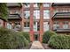 Exterior view of a red brick apartment building with balconies and well-maintained landscaping at 5200 Peachtree Rd # 3420, Atlanta, GA 30341