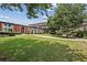 Beautifully landscaped courtyard showcasing a brick building with an open grass area at 5200 Peachtree Rd # 3420, Atlanta, GA 30341