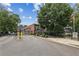 Gated community with well-maintained landscaping with a brick building and mature trees at 5200 Peachtree Rd # 3420, Atlanta, GA 30341
