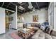 Open living area with exposed ductwork, concrete floors, and comfortable seating for relaxing or entertaining at 5200 Peachtree Rd # 3420, Atlanta, GA 30341