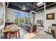 Bright living room with large windows, open ceiling, and a dining area, creating a spacious loft-style apartment at 5200 Peachtree Rd # 3420, Atlanta, GA 30341