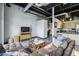 Spacious living room with an entertainment area with open floor plan to kitchen and exposed ductwork at 5200 Peachtree Rd # 3420, Atlanta, GA 30341