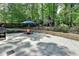 Backyard featuring a patio, grill, and outdoor seating at 5285 Bannergate Dr, Johns Creek, GA 30022