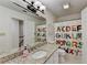 bathroom featuring granite countertop, white cabinets, and playful ABC shower curtain at 5285 Bannergate Dr, Johns Creek, GA 30022