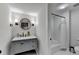 Updated bathroom featuring modern fixtures, a marble countertop, and a shower at 5285 Bannergate Dr, Johns Creek, GA 30022
