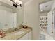 Clean bathroom featuring granite countertop, white cabinets, and playful ABC shower curtain detail at 5285 Bannergate Dr, Johns Creek, GA 30022