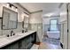 Updated bathroom with a double vanity, modern fixtures, and a luxurious soaking tub at 5285 Bannergate Dr, Johns Creek, GA 30022