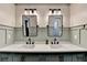 Contemporary bathroom with dual sinks, framed mirrors, and modern lighting fixtures at 5285 Bannergate Dr, Johns Creek, GA 30022