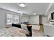 Bright bedroom with hardwood floors, a large window, and a sewing machine desk at 5285 Bannergate Dr, Johns Creek, GA 30022