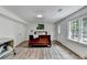 Bright bedroom with hardwood floors, a large window, and plenty of natural light at 5285 Bannergate Dr, Johns Creek, GA 30022