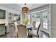 Charming dining room with bay window, providing ample natural light and views of the lush backyard at 5285 Bannergate Dr, Johns Creek, GA 30022