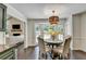 Charming breakfast nook featuring a round table with chairs, with easy access to the living room at 5285 Bannergate Dr, Johns Creek, GA 30022