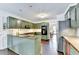 Well-appointed kitchen with granite countertops and a view into a bright and spacious breakfast nook at 5285 Bannergate Dr, Johns Creek, GA 30022