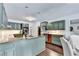 Well-appointed kitchen featuring a granite island, stainless steel appliances, and custom cabinets at 5285 Bannergate Dr, Johns Creek, GA 30022