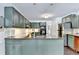 Well-appointed kitchen featuring a granite island, stainless steel appliances, and custom cabinets at 5285 Bannergate Dr, Johns Creek, GA 30022