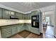 Stylish kitchen with updated appliances, custom cabinets and easy access to the dining room at 5285 Bannergate Dr, Johns Creek, GA 30022