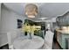 Charming eat-in kitchen featuring a round table with chairs, granite counters and abundant light at 5285 Bannergate Dr, Johns Creek, GA 30022