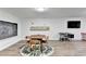 A well lit living room that features a unique table and chairs set, with a blackboard on the wall at 5285 Bannergate Dr, Johns Creek, GA 30022