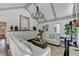 Bright and spacious living room with a vaulted ceiling, a modern chandelier, and stylish decor at 5285 Bannergate Dr, Johns Creek, GA 30022