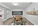 A well lit living room that features a unique table and chairs set, with a blackboard on the wall at 5285 Bannergate Dr, Johns Creek, GA 30022