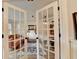 Stylish living room featuring French doors, hardwood floors, and a decorative rug at 5285 Bannergate Dr, Johns Creek, GA 30022