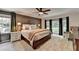 Cozy main bedroom with a large bed, neutral carpet, and natural light at 5285 Bannergate Dr, Johns Creek, GA 30022