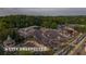 Outdoor concert venue featuring a stage, lawn seating, and trees from an aerial view at 1003 River Plantation Dr, Woodstock, GA 30188