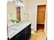 Bathroom features a double sink vanity, large mirror, and walk-in closet at 1003 River Plantation Dr, Woodstock, GA 30188