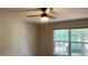 Bedroom featuring ceiling fan and large window at 1003 River Plantation Dr, Woodstock, GA 30188