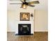 Living room fireplace with black grate and white mantel at 1003 River Plantation Dr, Woodstock, GA 30188
