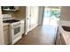 Open concept kitchen featuring stainless steel appliances and tile flooring at 1003 River Plantation Dr, Woodstock, GA 30188