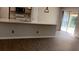 Open-concept living space with sliding doors to the outside at 1003 River Plantation Dr, Woodstock, GA 30188