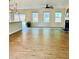 Bright and open living room with hardwood floors, fireplace, and multiple windows at 1003 River Plantation Dr, Woodstock, GA 30188