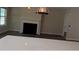 View of a living room with fireplace from the kitchen island at 1003 River Plantation Dr, Woodstock, GA 30188