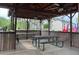 Covered picnic area with picnic tables and ceiling fans for outdoor enjoyment at 1003 River Plantation Dr, Woodstock, GA 30188