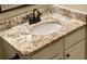 Close up of vanity showing granite countertop and oil rubbed bronze faucet at 1003 River Plantation Dr, Woodstock, GA 30188