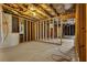 Unfinished basement with block wall and exposed wood beams at 1138 School Side Dr, Lithonia, GA 30058