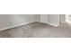 This carpeted bedroom features a neutral color scheme, a closet, and neutral walls at 1138 School Side Dr, Lithonia, GA 30058