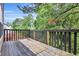 Back deck overlooking a wooded backyard at 1138 School Side Dr, Lithonia, GA 30058