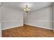 This dining room has hardwood floors and classic chandelier at 1138 School Side Dr, Lithonia, GA 30058