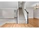 Entryway features beautiful hardwood floors and a staircase leading to the upper level at 1138 School Side Dr, Lithonia, GA 30058