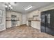 Kitchen with updated stainless steel appliances and tile flooring at 1138 School Side Dr, Lithonia, GA 30058