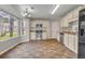 Eat-in kitchen with stainless steel appliances, tile backsplash, and natural light at 1138 School Side Dr, Lithonia, GA 30058