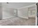 Neutral living room with carpet, windows, and traditional crown molding at 1138 School Side Dr, Lithonia, GA 30058