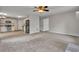 Open-concept living area with tile floors, recessed lighting, and stainless steel appliances at 1138 School Side Dr, Lithonia, GA 30058