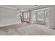 Living room boasts bay window, staircase and hardwood floors at 1138 School Side Dr, Lithonia, GA 30058